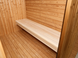 Smalle houten bank langs de wand in de voorruimte van de Passion Cube Luxury 300 Multiroom sauna.